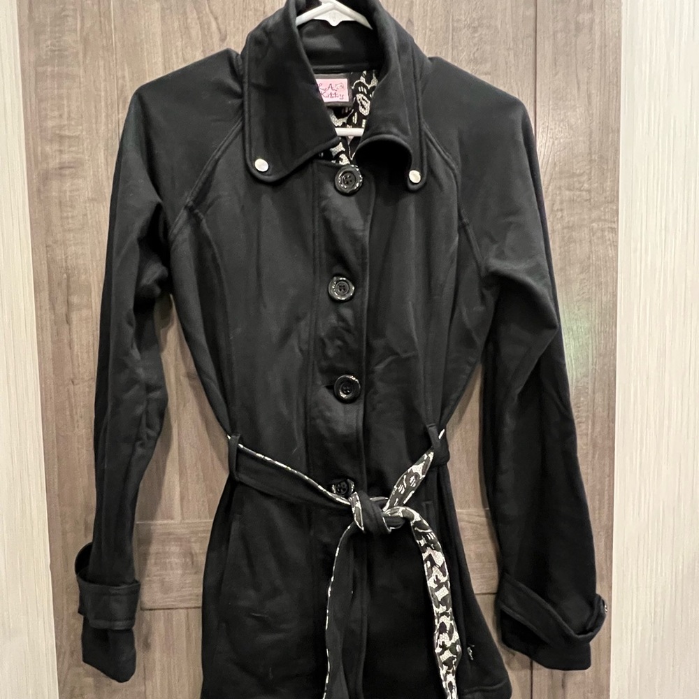 Black pea coat/trench coat. Large buttons with belted waist.